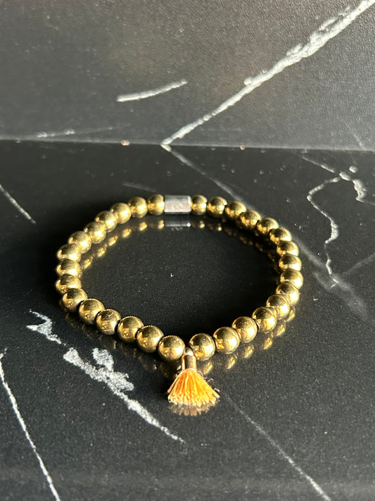 Heilstein-Perlenarmband „Heal“ mit Quaste, Farbe gold/orange, Größe M